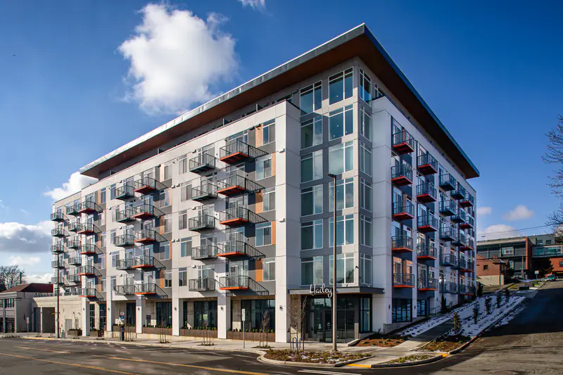 Tacoma, WA Apartments - Exterior View of Hailey Apartments Building Surrounded with View of Parking Lot